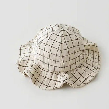 Grid-patterned bucket hat on a light gray background